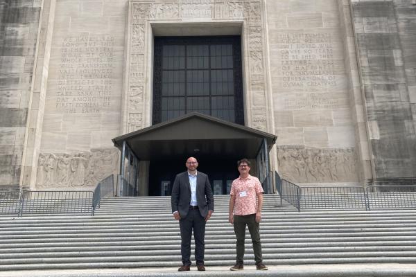 TK体育 students Jody Billiot and Walker J. Reisman stand in front of the Louisiana Capitol building