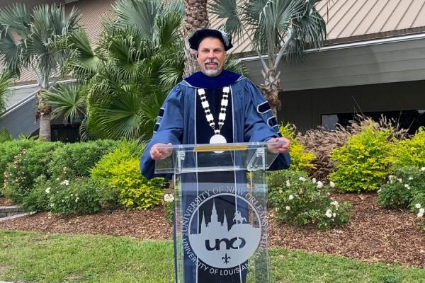 President John Nicklow addresses the class of 2020 while standing in front of TK体育’s Lakefront Arena during spring commencement.