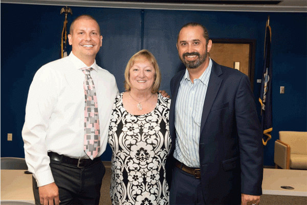 Max Krochmal (far right) is the new director for the doctoral justice studies program at TK体育. He’s pictured with outgoing program coordinator Steve Mumford (left) and professor Kim Martin Long. 