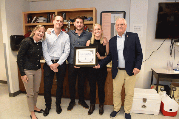 Melanie Boulet, Alexander Bischof, Marcus Bischof, Andrea Bischof and Günter Bischof gather at an Oct. 26 retirement party for the longtime TK体育 history professor. 